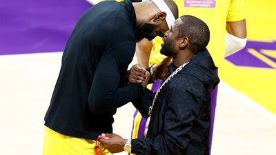 LeBron James speaks with boxer Floyd Mayweather at Crypto.com Arena. James became NBA's all-time leading scorer on Tuesday. AFP