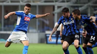 Napoli's Elif Elmas in action against Inter Milan's Alessandro Bastoni. EPA