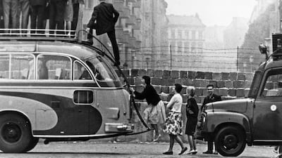 BERLIN - 1964: Sightseers climb onto a bus to look at the newly-built Berlin Wall in 1964 in Berlin, Germany. Saturday, August 13th 2011 will mark 50 Years Since East German Troops Sealed The Border Between East And West Berlin. (File Photo/Keystone/Gett???