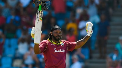 Chris Gayle of West Indies celebrates his half century during the fifth and final ODI against England in Saint Lucia. AFP