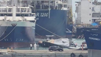 Iranian warship Sahand capsizes in the port of Bandar Abbas. Authorities said the ship became unbalanced due to "water infiltration during repairs." Photo: Tasnim News Agency