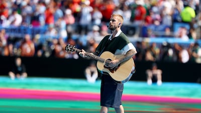 Justin Bieber sings and plays the guitar during the halftime show. Reuters