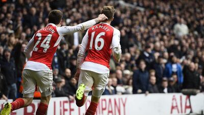 Football Soccer - Tottenham Hotspur v Arsenal - Barclays Premier League - White Hart Lane - 5/3/16Aaron Ramsey celebrates with Hector Bellerin (L) after scoring the first goal for ArsenalReuters / Dylan MartinezLivepicEDITORIAL USE ONLY. No use with unauthorized audio, video, data, fixture lists, club/league logos or "live" services. Online in-match use limited to 45 images, no video emulation. No use in betting, games or single club/league/player publications. Please contact your account representative for further details.