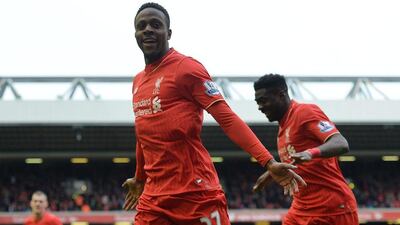 Liverpool’s Divock Origi (C) celebrates scoring the fourth goal making the score 3-1 during the Premier League match between Liverpool and Stoke City at the Anfield, Manchester, Britain, 10 April 2016. EPA/PETER POWELL