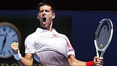 Serbia's Novak Djokovic reacts after winning a point against Switzerland's Marco Chiudinelli.
