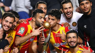 Esperance players celebrate with the CAF Champions League trophy after defeating Al Ahly 3-0 in the second leg. Reuters