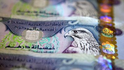 The UAE Central Bank Governor Mubarak Rashed Al Mansoori reiterated his country’s commitment to the dollar peg earlier this month. Pictured, UAE dirham notes. Pawan Singh / The National