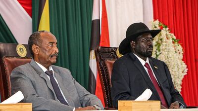 President of Sudanese Transitional Council General Abdel Fattah al-Burhan, left, and President of South Sudan Salva Kiir attend a meeting to endorse the peace talks between Sudan's government and rebel leaders in Juba, South Sudan, on October 14, 2019. AFP