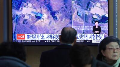 A TV screen shows an image of a North Korean long-range rocket launch site during a news program in Seoul. AP