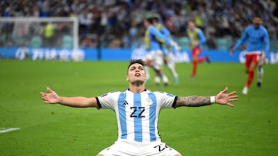 Lautaro Martinez celebrates after scoring the winning penalty for Argentina. Getty