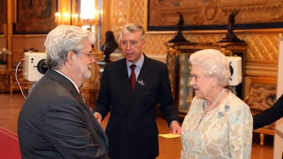 Queen Elizabeth meets 'Star Wars' director George Lucas at Windsor Castle. Getty