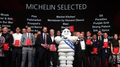 Chefs proudly stand with their awards during the 'Michelin Guide Abu Dhabi' unveiling at Emirates Palace. All photos Pawan Singh / The National