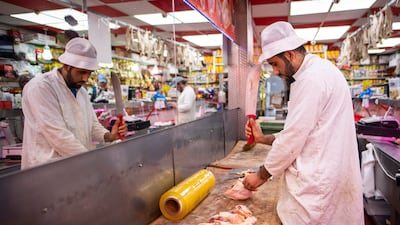 A butcher cuts chicken at Walthamstow Street Market on May 26, 2020 in London, England. Getty