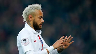 PSG's Neymar holds up two and four fingers to mark Bryant's number 24 shirt after he scored against Lille. AP Photo