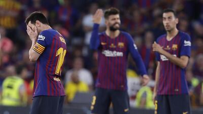 Lionel Messi, left, cannot hide his emotions as Barcelona fall to defeat. EPA