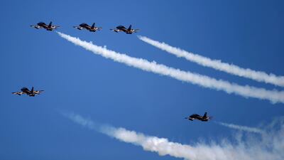 The Al Fursan National Aerobatic Team perform a fly-by. EPA