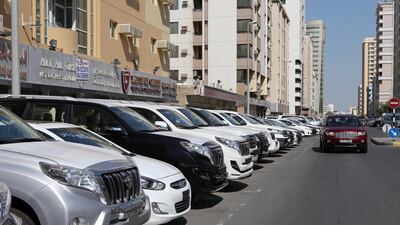 Used cars on display outside the shop of used car dealers in Abu Shagara area in Sharjah. Pawan Singh / The National