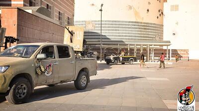 Forces of Libya’s Government of National Accord in front of the Ouagadougou conference centre in Sirte after they captured it from ISIL. GNA handout / AFP / August 10, 2016