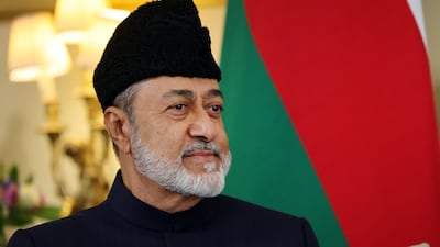 Sultan Haitham listens to the British Prime Minister. EPA