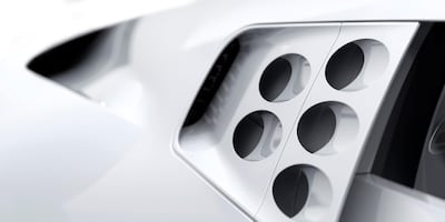 An assortment of styling cues link the car to the EB 110, such as the oval perforations in the upper-rear section of its flanks and headlights set well back in the nose. Courtesy Bugatti