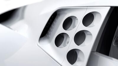 An assortment of styling cues link the car to the EB 110, such as the oval perforations in the upper-rear section of its flanks and headlights set well back in the nose. Courtesy Bugatti