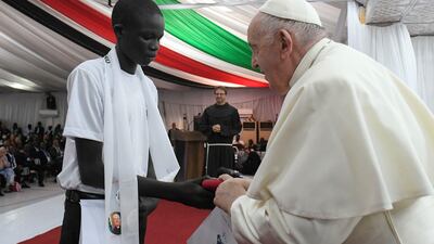 Pope Francis receives a gift. AFP