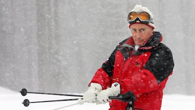 A snowmobile pulls Putin as he visits a mountainside of Sochi resort on February 20, 2007. AFP