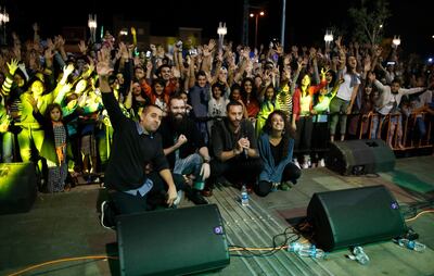 DAM poses with audience members after performing during a festival in the northern Arab-Israeli town of Sakhnin. AFP