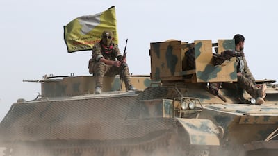 Syrian Democratic Forces fighters sit on a vehicle in the north of Raqqa. Rodi Said / Reuters