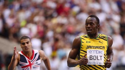 Jamaica's Usain Bolt , right, shown here as he wins the men's 200 metres final at the 2013 IAAF World Championships in Moscow in 2013, will be a top draw at the 2014 Commonwealth Games in Glasgow. AFP PHOTO / OLIVIER MORIN