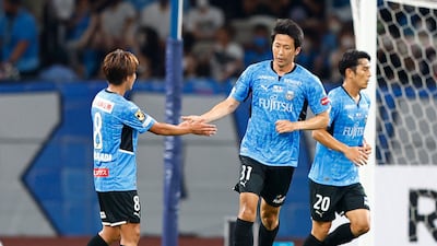 Kawasaki Frontale's Kazuya Yamamura celebrates scoring with Kento Tachibanada. Reuters