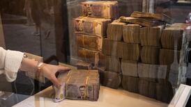 Syrian pounds in a money exchange shop in Damascus. Syria plans to issue new bank notes and eliminate two zeroes from its currency. Getty Images