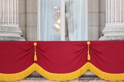 Prince George of Cambridge peers out of the window of Buckingham Palace. Getty Images