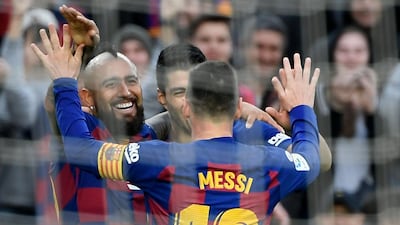 Arturo Vidal, Luis Suarez and Lionel Messi celebrate. AFP