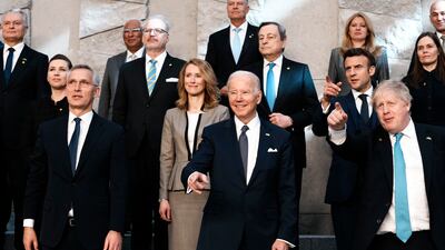Nato Secretary General Jens Stoltenberg, front left, US President Joe Biden and British Prime Minister Boris Johnson pose for a photo during an extraordinary Nato summit in Brussels. AP Photo