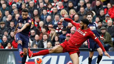 Liverpool's Joe Gomez with Bournemouth's Junior Stanislas. Reuters
