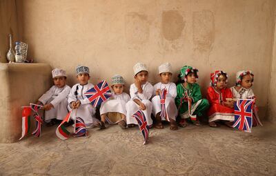 Omani children wait to greet the then Prince of Wales and Camilla, Duchess of Cornwall, at Nizwa Fort in March 2013. Getty