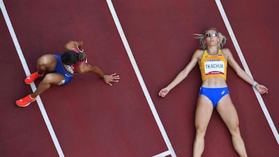 Ukraine's Viktoriya Tkachuk, right, and USA's Sydney Mclaughlin react after competing in the women's 400m hurdles final during the Tokyo 2020 Olympic Game.