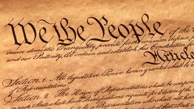 The first page of the US Constitution which separates the power of the government into three separate branches: a legislative branch to make the laws; an executive branch to carry out the laws; and a judicial branch to interpret the laws. Getty Images