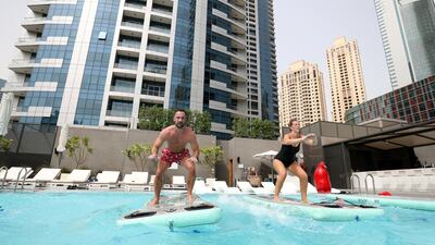 Exercising on the water forces the participant to balance while performing moves, further helping strengthen the core. The Boga Fitmat requires users to engage more muscles during the workout as they try to maintain their balance. Chris Whiteoak / The National