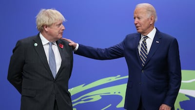 British Prime Minister Boris Johnson greets US President Joe Biden as leaders arrive to attend the Cop26 Sumimt. EPA