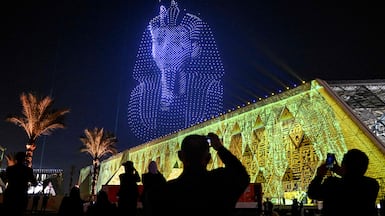Lightning effects depicting the funerary mask of ancient Egyptian King Tutankhamun light up the sky during the opening ceremony in Giza. AFP