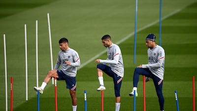 Juan Bernat, Achraf Hakimi and Kylian Mbappe during training on Thursday. AFP