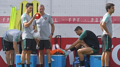 Portugal's forward Cristiano Ronaldo, second right, relaxes during training. Francisco Leong / AFP