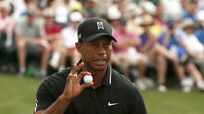 Tiger Woods salutes the crowd after making par on the 16th hole during his second round at The Masters. Phil Noble / Reuters