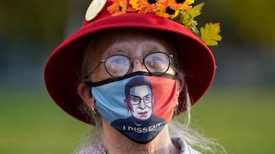 A woman listens to speakers outside of Revolution Hall before marching in Portland, Oregon. AP Photo