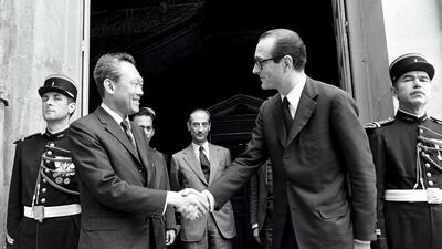 Singapore Prime Minister Lee Kuan Yew (left) shakes hands with French Prime Minister Jacques Chirac at Matignon in Paris on July 2, 1974. AFP
