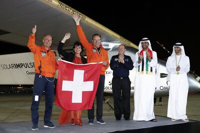 Dr Sultan Al Jaber, with from left, Solar Impulse 2 pilot Bertrand Piccard, Swiss Energy Minister Doris Leuthard, co-pilot Andre Borschberg, Prince Albert II of Monaco and Dr Thani Al Zeyoudi after the plane landed in Abu Dhabi. EPA