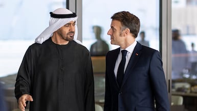 SAADIYAT ISLAND, ABU DHABI, UNITED ARAB EMIRATES - December 21, 2025: HH Sheikh Mohamed bin Zayed Al Nahyan, President of the United Arab Emirates (center L), receives HE Emmanuel Macron, President of France (center R), arrive to a lunch meeting at the Zayed National Museum. ( Ryan Carter / UAE Presidential Court )