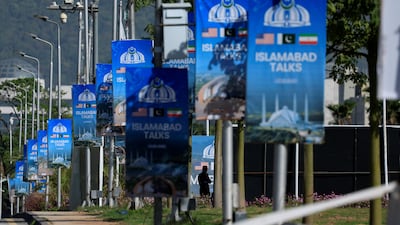 Posters in Islamabad indicate that Pakistan is still hopeful of hosting US and Iranian officials for a second round of peace talks later this week. Reuters